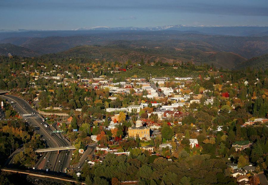 Aerial view of Auburn, California in autumn, with the courthouse dome and the Sierra foothills.